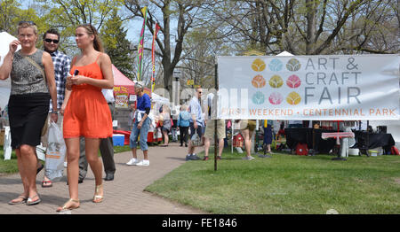 HOLLAND, MI - MAY 3: Patrons enjoy the Tulip Time Festival Art Fair in Holland, MI May 3, 2015. Stock Photo
