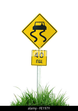 Yellow slippery road sign and green grass isolated on white background Stock Photo
