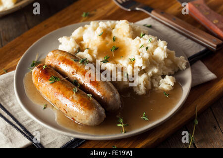 Homemade Bangers and Mash with Herbs and Gravy Stock Photo