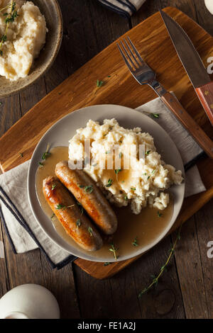 Homemade Bangers and Mash with Herbs and Gravy Stock Photo