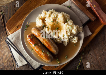 Homemade Bangers and Mash with Herbs and Gravy Stock Photo