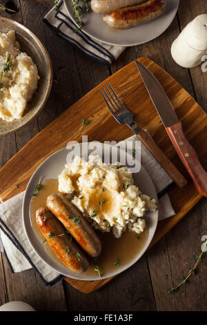 Homemade Bangers and Mash with Herbs and Gravy Stock Photo