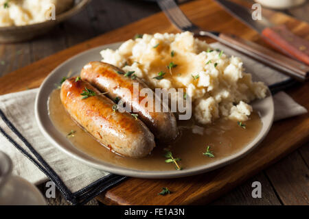 Homemade Bangers and Mash with Herbs and Gravy Stock Photo