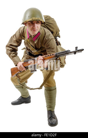 a young Soviet soldier with SVT rifle on the white background Stock Photo