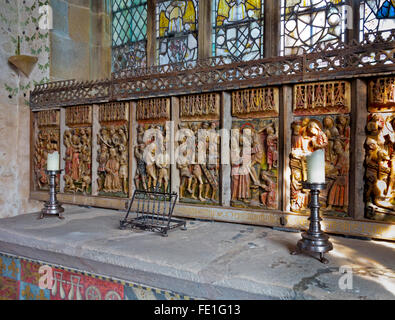 Medieval carved wooden altar piece depicting the crucifixion of Jesus Christ in the chapel at Haddon Hall in Derbyshire England Stock Photo