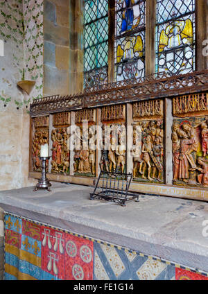 Medieval carved wooden altar piece depicting the crucifixion of Jesus Christ in the chapel at Haddon Hall in Derbyshire England Stock Photo