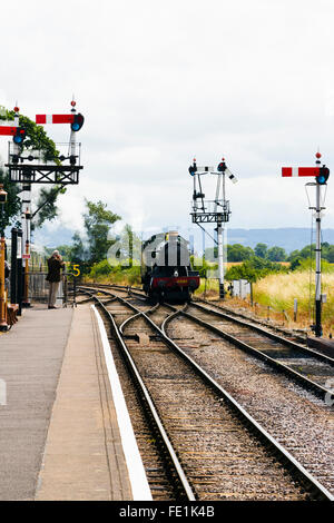Steam train approaching Watchet Station on the West Somerset Railway, UK Stock Photo