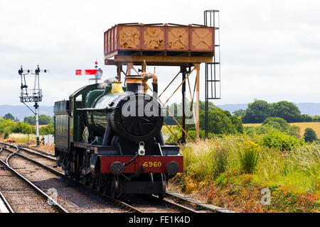 Steam train approaching Watchet Station on the West Somerset Railway, UK Stock Photo