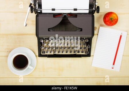 Vintage french typewriter on a wooden table. Filtered photo, main focus on keyboard. Translation keys: majuscules-big; declenche Stock Photo