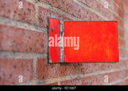 Vintage house number plate on brick wall Stock Photo