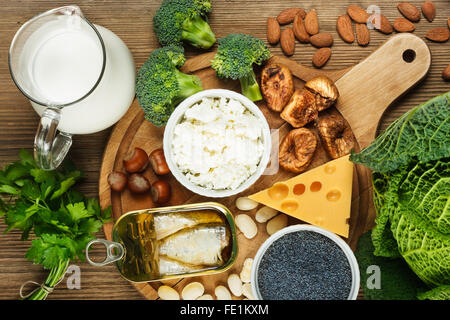 Foods rich in calcium such as sardines, bean, dried figs, almonds, cottage cheese, hazelnuts, parsley leaves, blue poppy seed, b Stock Photo