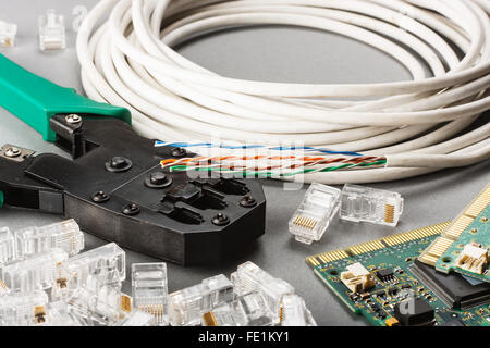 Crimper, network cable and connectors Stock Photo