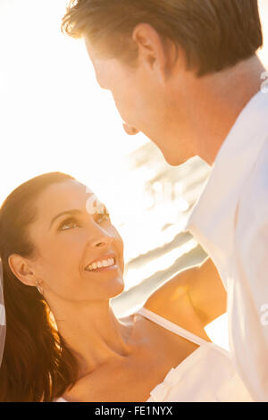Beautiful bride and groom at sunset in green nature Stock Photo - Alamy