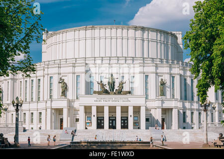People walking near National Academic Bolshoi Opera and Ballet Theatre in Minsk, Belarus. Right angle view to theatre building. Stock Photo