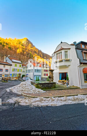 View of Fountain in Bad Ragaz in winter. Bad Ragaz is a city in the canton St. Gallen in Switzerland.  It lies over the Graubunden Alps. The Spa and recreation village is at the end of Tamina valley Stock Photo