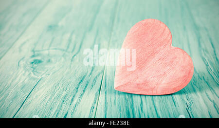 Cross processed heart on wooden background, space for text. Stock Photo