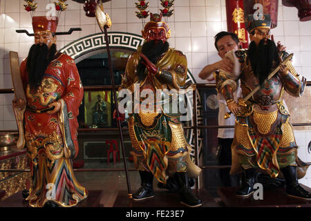Sumatra, Indonesia. 04th Feb, 2016. Indonesian of Chinese descent wash Chinese god statue in preparation for Chinese New Year celebration at a temple Gunung Timur, North Sumatra, Indonesia, February 4, 2016. A ritual was held in the Chinese lunar calendar in month 12, as is believed the gods back to meet in heaven in celebrating the Chinese New year, the Chinese community in the country's most populous Muslim in the world are getting ready to celebrate the beginning year of the monkey, which falls on February 8, 2016. Credit:  Ivan Damanik/Alamy Live News Stock Photo