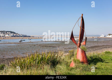 View from Instow across the Torridge Estuary to Appledore and Braunton Burrows. Red metal sculpture in foreground. Stock Photo