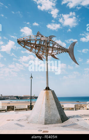 Weather vane in the form of tuna on the background of sunny landscape in Tarifa, Spain. Designed by Pedro L.Barbera. Beach. Sky. Stock Photo