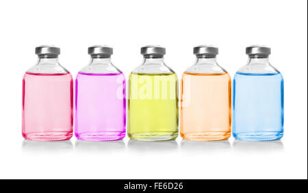 Five colored bottles with essential oils, isolated on white Stock Photo