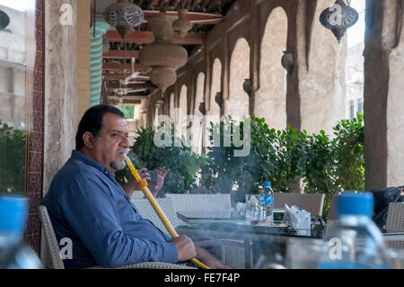 Doha Qatar Middle East man smoking hookah pipe Stock Photo