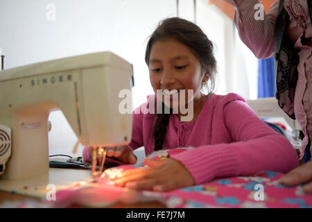 Girl using sewing machine, tailoring, vocational training, Creciendo Unidos social project, Javier Villa, Bogotá, Colombia Stock Photo