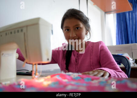 Girl using sewing machine, tailoring, vocational training, Creciendo Unidos social project, Javier Villa, Bogotá, Colombia Stock Photo