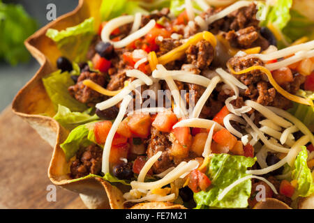 Taco Salad in a Tortilla Bowl with Beef Cheese and Lettuce Stock Photo