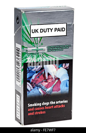 Cigarette packet with warning about smoking and heart attacks and UK Duty Paid Stock Photo