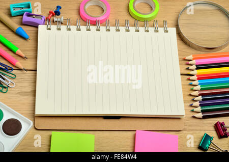 School supplies and notebook on wooden table Stock Photo