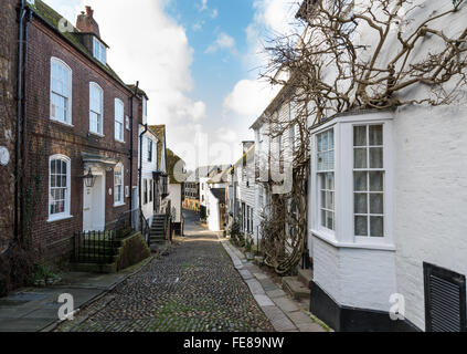 Looking down the cobbled Mermaid Street in Rye, East Sussex, towards Strand Quay and the Heritage Centre. Stock Photo