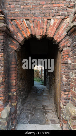 Historic brick archway and wooden door in Old Grammar School, Rye High Street, Sussex UK, founded in 1636 by Thomas Peacocke. Stock Photo