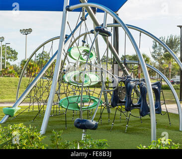 playground with slides and climbing frame in park Stock Photo