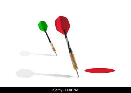 Darts Outside of a Red Target on a White Background Stock Photo