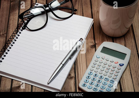 Notebook and supplies on table Stock Photo