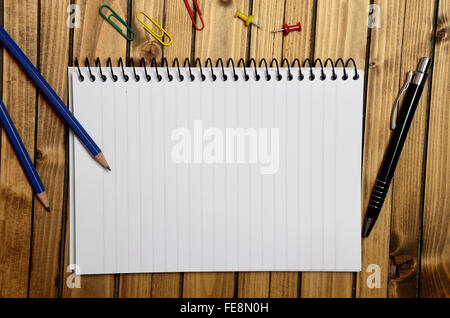 Assorted office supplies on wooden table Stock Photo