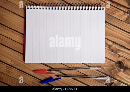 Empty notepad and pen on table Stock Photo