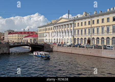 A tourist boat cruising on Moyka River in St Petersburg, Russia. Stock Photo