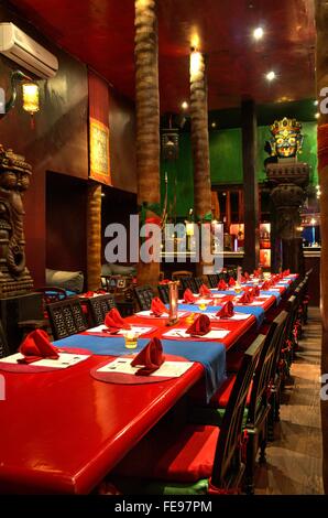 Exotic, rustic Asian themed dining room Stock Photo