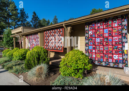 Quilts hanging on a building at the Sisters Outdoor Quilt Show, SIsters, Oregon Stock Photo