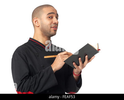 Afro American professional cook holding cookbook - isolated on white background. Stock Photo