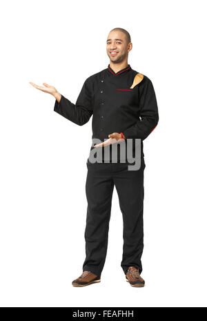 Fullbody portrait of Afro American professional cook presenting isolated on white. Stock Photo