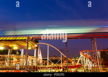 Evening picture carousel in an amusement park at autumn time Stock Photo