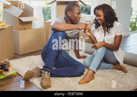 Ethnic couple toasting with champagne Stock Photo