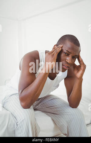 Handsome man having headache Stock Photo