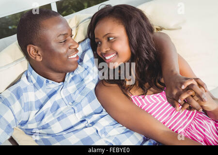 Ethnic couple resting on the couch Stock Photo