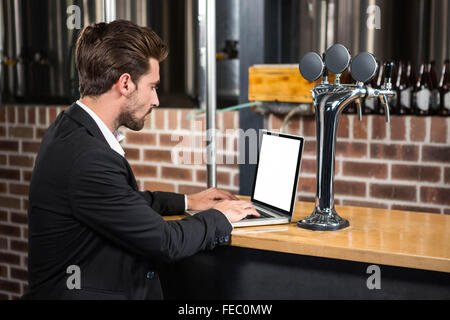 Handsome businessman using laptop Stock Photo