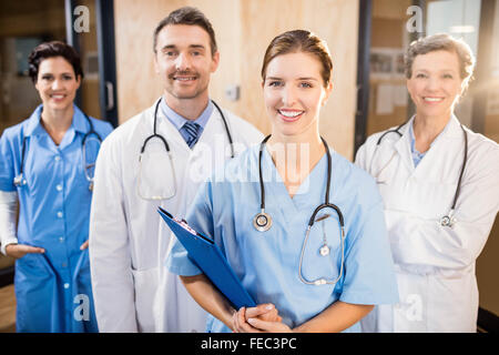 Medical team smiling at camera together Stock Photo