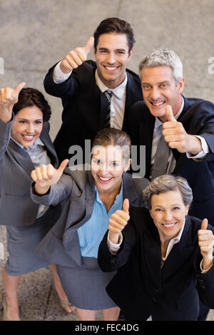 Business team showing thumbs up Stock Photo
