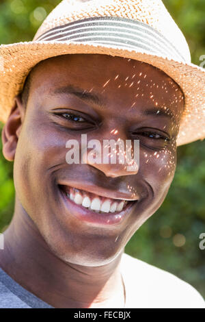 Handsome man wearing straw hat Stock Photo
